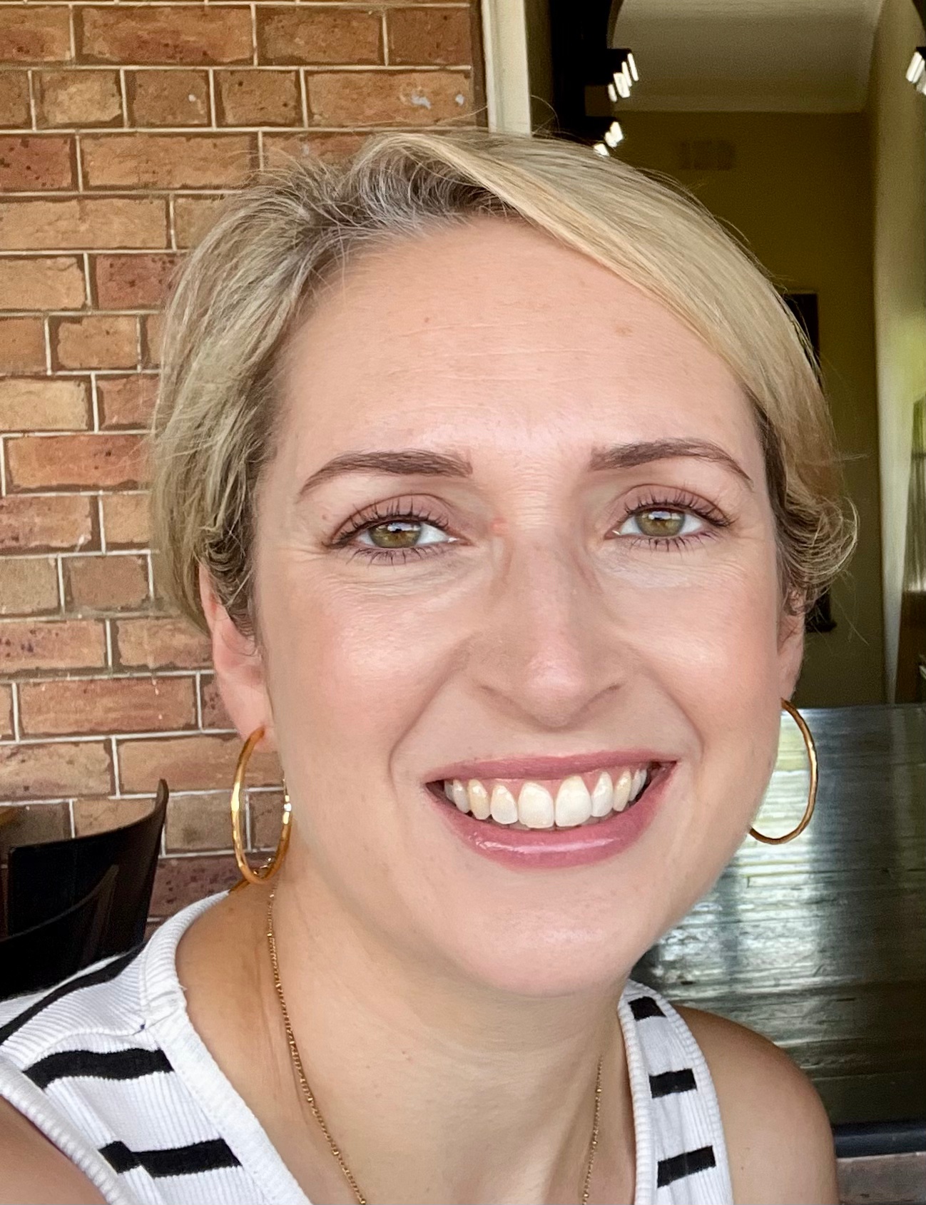 A headshot Katie Harris, counsellor, smiling at the camera. 